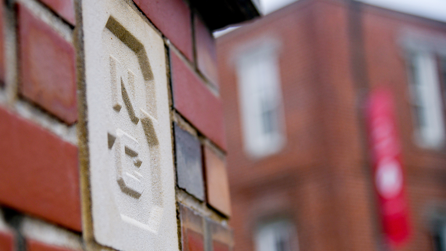 Close-up of block "S" that marks an entrance to main campus.